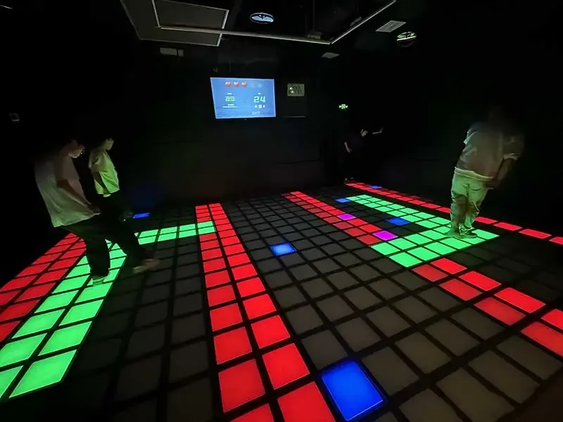 Two players crossing a green path between red lava tiles
