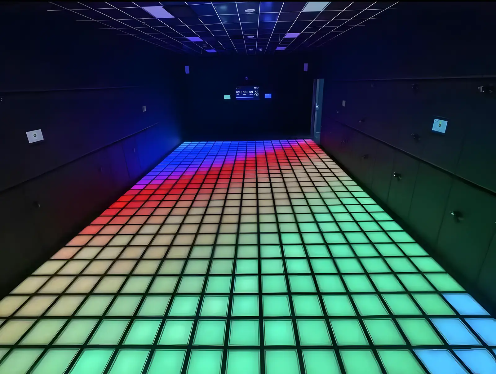 An empty Lava Floor room with its LED floor lit from red to green ahead of a game
